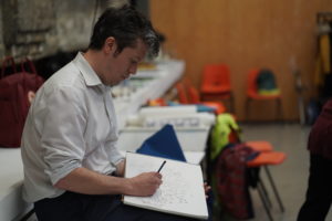 An image of a person drawing an art
